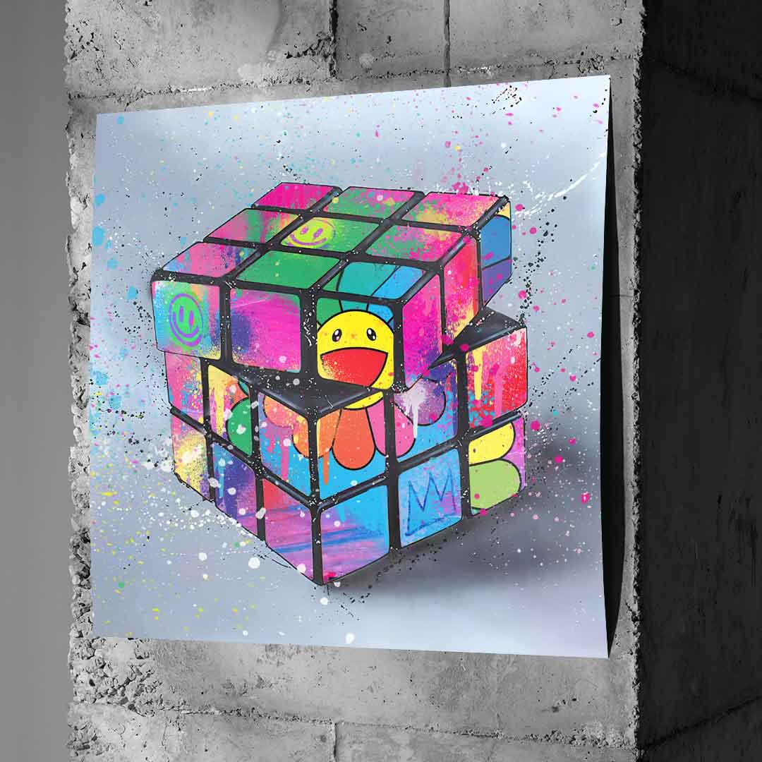 Close-up of the smiling yellow flower at the center and colorful cube facets in Rubik's Flower with pink, green, blue and orange graffiti tones.