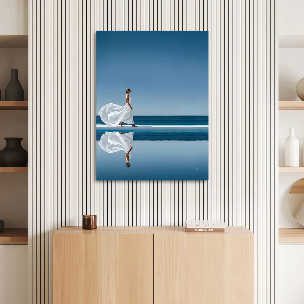 Minimalist blue landscape with a white-dressed woman walking along a bright pool edge and distant sea.