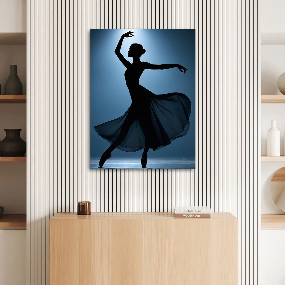 Flowing sheer fabric swirls around the dancer as dramatic lighting highlights her form.