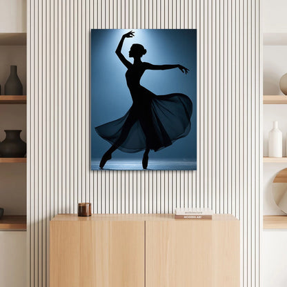 Flowing sheer fabric swirls around the dancer as dramatic lighting highlights her form.
