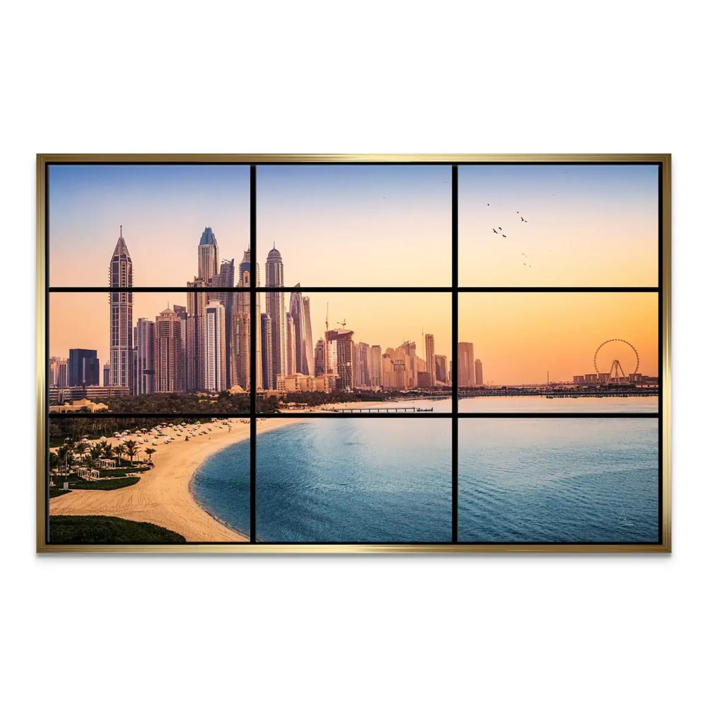 Ain Dubai Ferris wheel visible on the horizon under a warm sunset sky