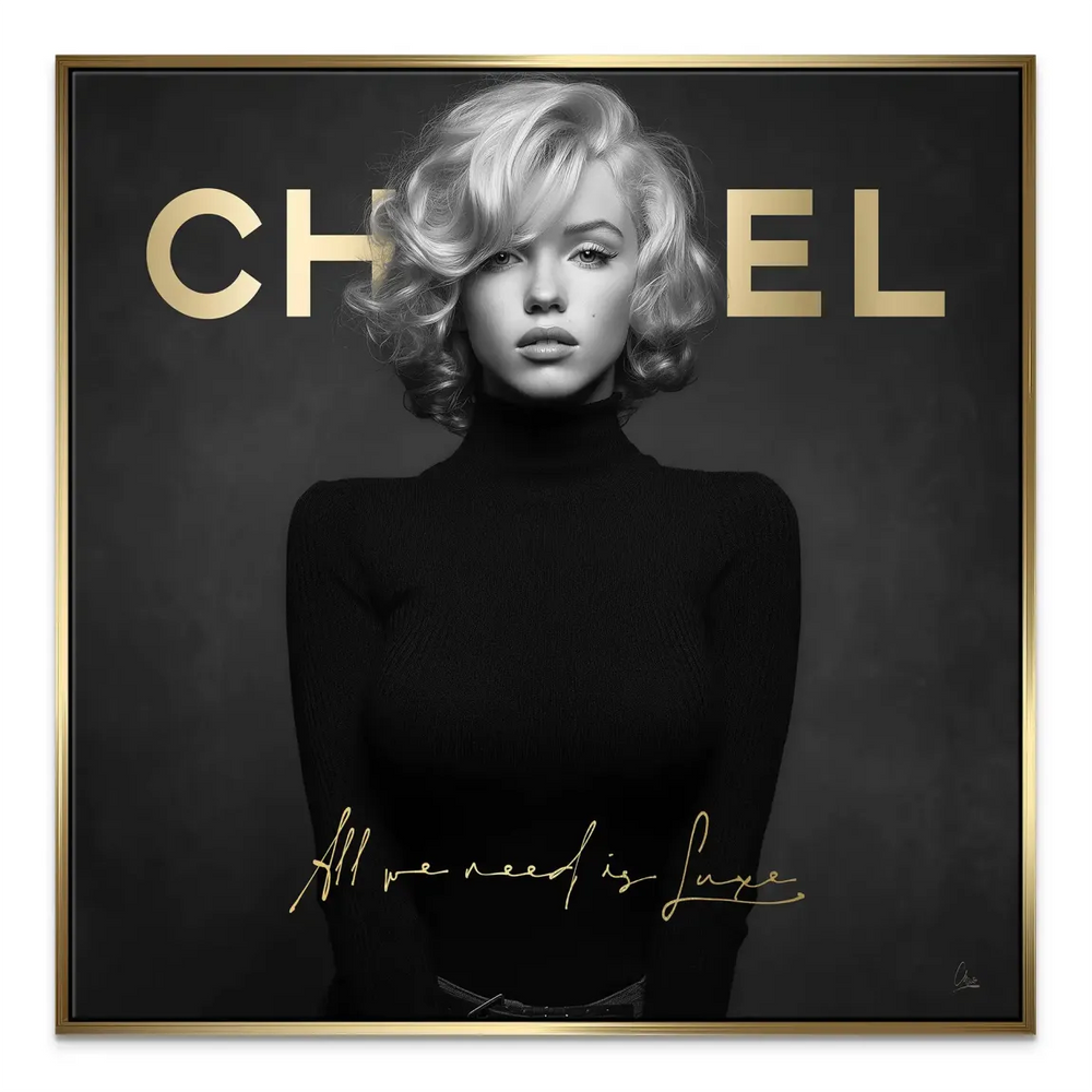 Close-up of the gold script All we need is Luxe over Marilyn Monroe portrait