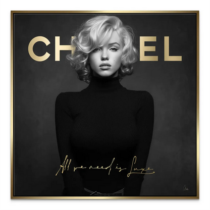 Close-up of the gold script All we need is Luxe over Marilyn Monroe portrait