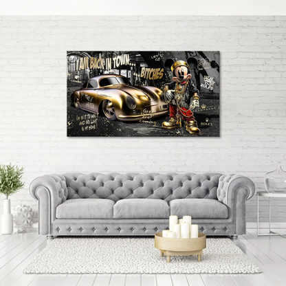 Close-up of the gold Porsche 356 with Mickey Mouse wearing gold chains in a monochrome urban graffiti setting
