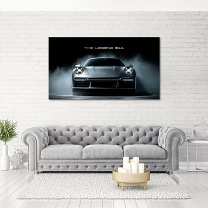 Sleek silver Porsche 911 shown from a slight side angle against a deep black backdrop.