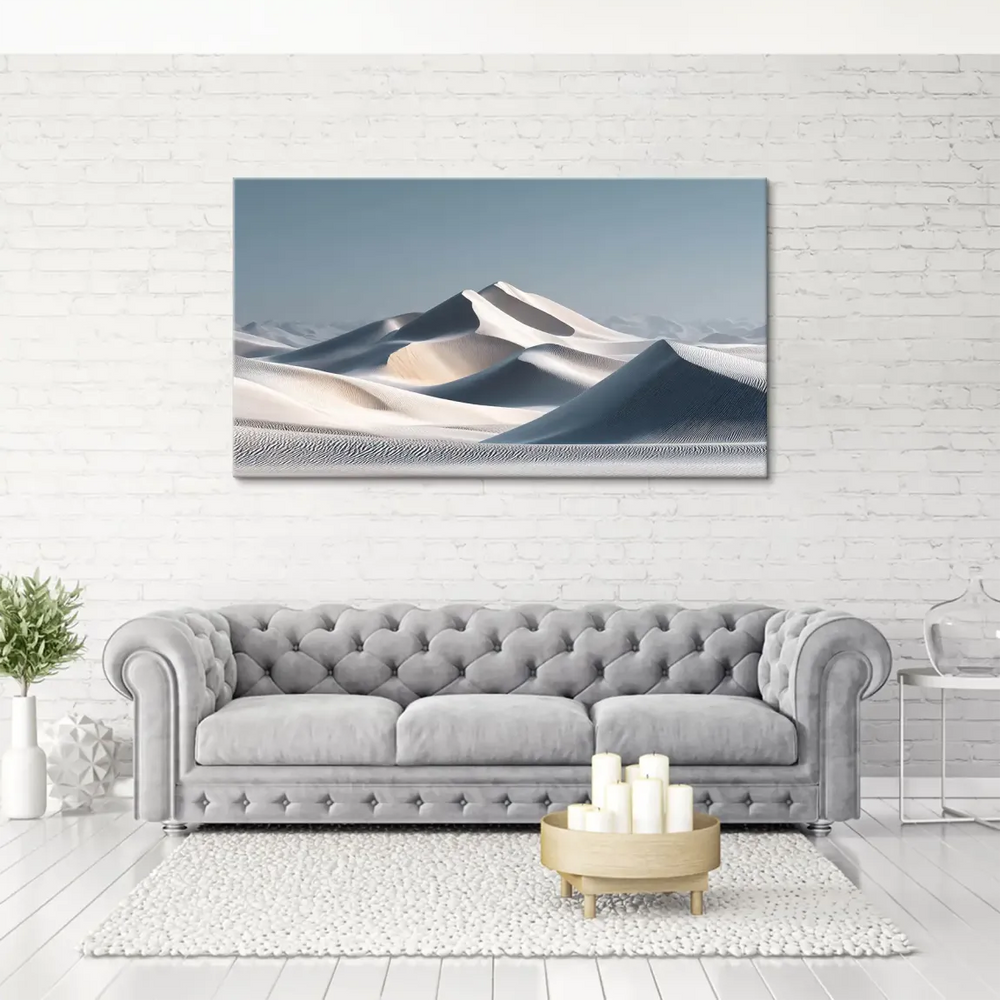 Minimalist desert landscape showing creamy ivory dunes and cool blue shadows.