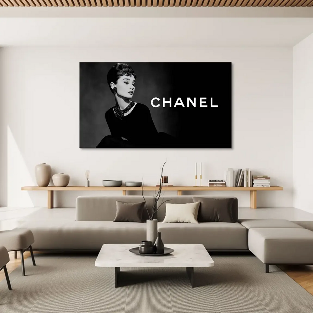 Muted grey background with a bold Chanel-inspired logo on the right