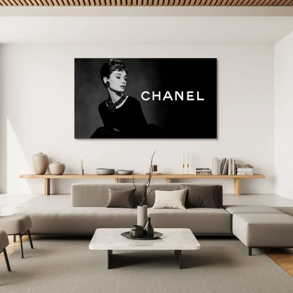 Muted grey background with a bold Chanel-inspired logo on the right