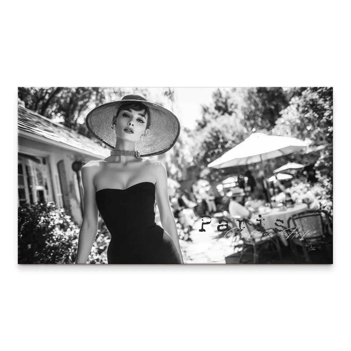 Glamorous Audrey Hepburn-inspired woman in a strapless black dress with a wide-brim hat on a black-and-white canvas with Parisian cafe backdrop