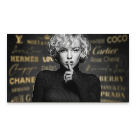 Black-and-white Marilyn Monroe portrait on canvas with a shushing gesture and a blurred gold-brand background.