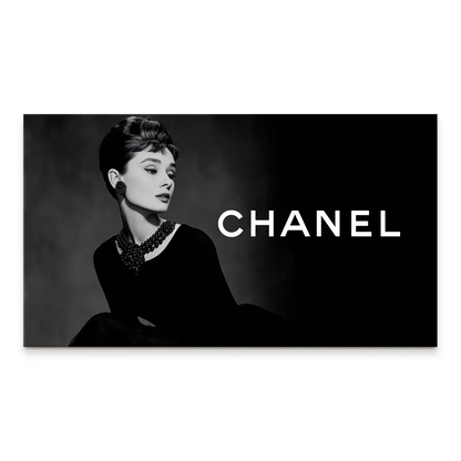 Audrey Hepburn in black-and-white portrait on canvas with elegant gown