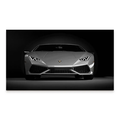 Front-on grayscale Lamborghini Huracan canvas print with a dark background and bright LED headlights.