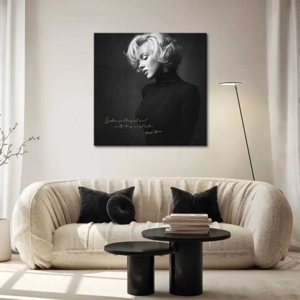 Contemplative Marilyn Monroe portrait with moody dark background and gold lettering