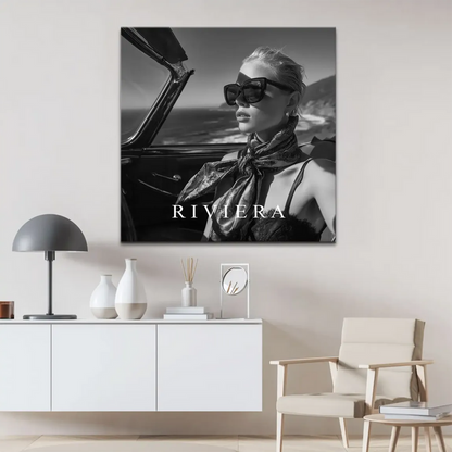 Elegant profile of a sophisticated traveler in a retro car with ocean backdrop and motion blur.