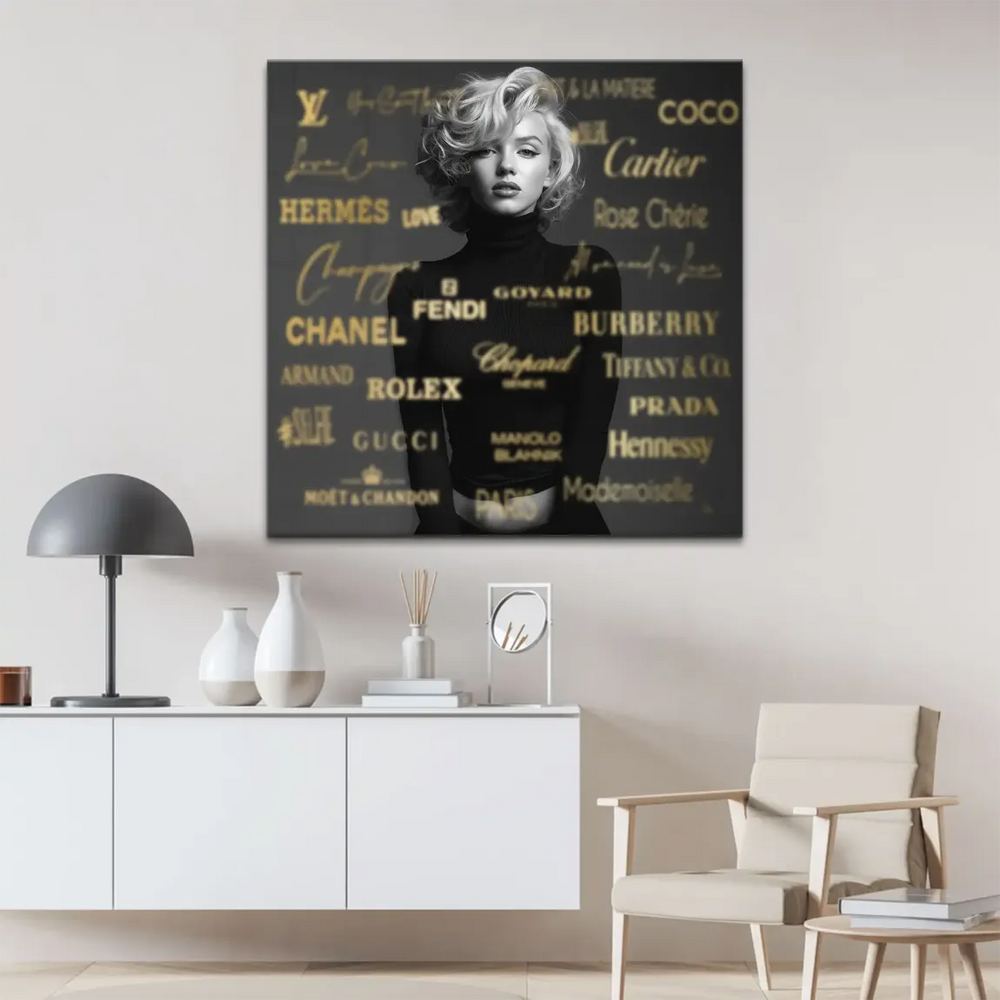 Marilyn Monroe wall art in black and white with metallic gold logo accents.