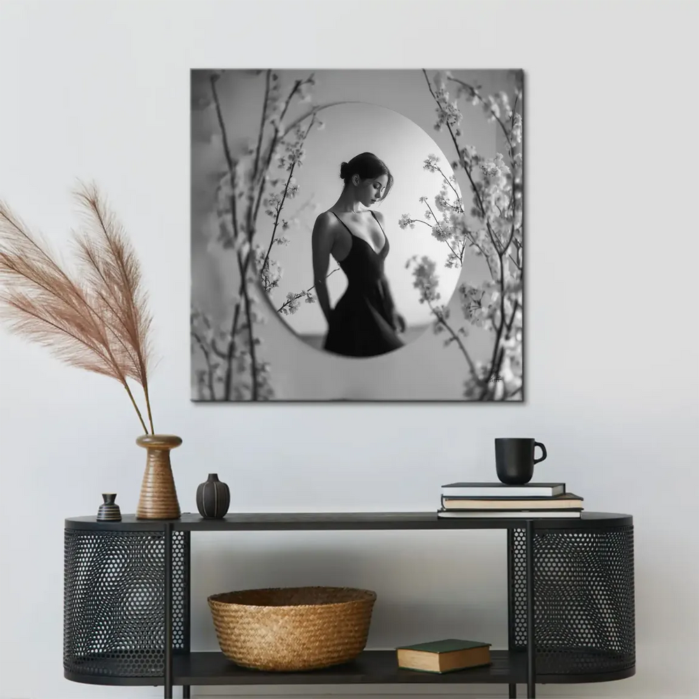 Monochrome image of a serene woman looking down, elegant fashion portrait.