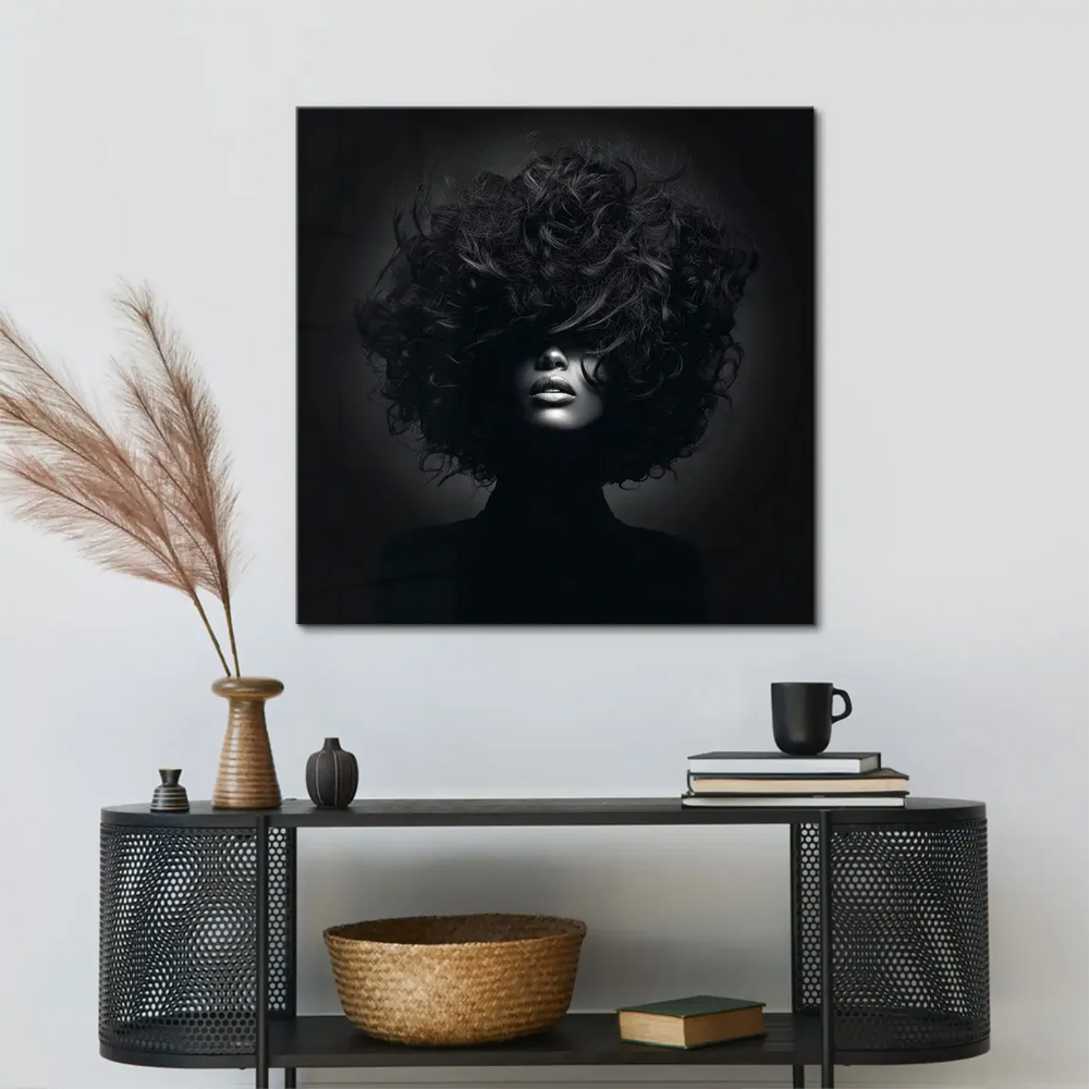 Close-up of dramatic black-and-white contrast showing hair texture and facial contours