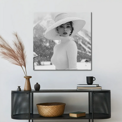 Stylish figure in a ribbed turtleneck against soft grey snow and distant mountains.