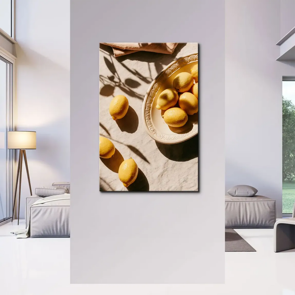 Bright yellow fruit on an ivory dish with soft backdrop in a sunny wall art canvas.
