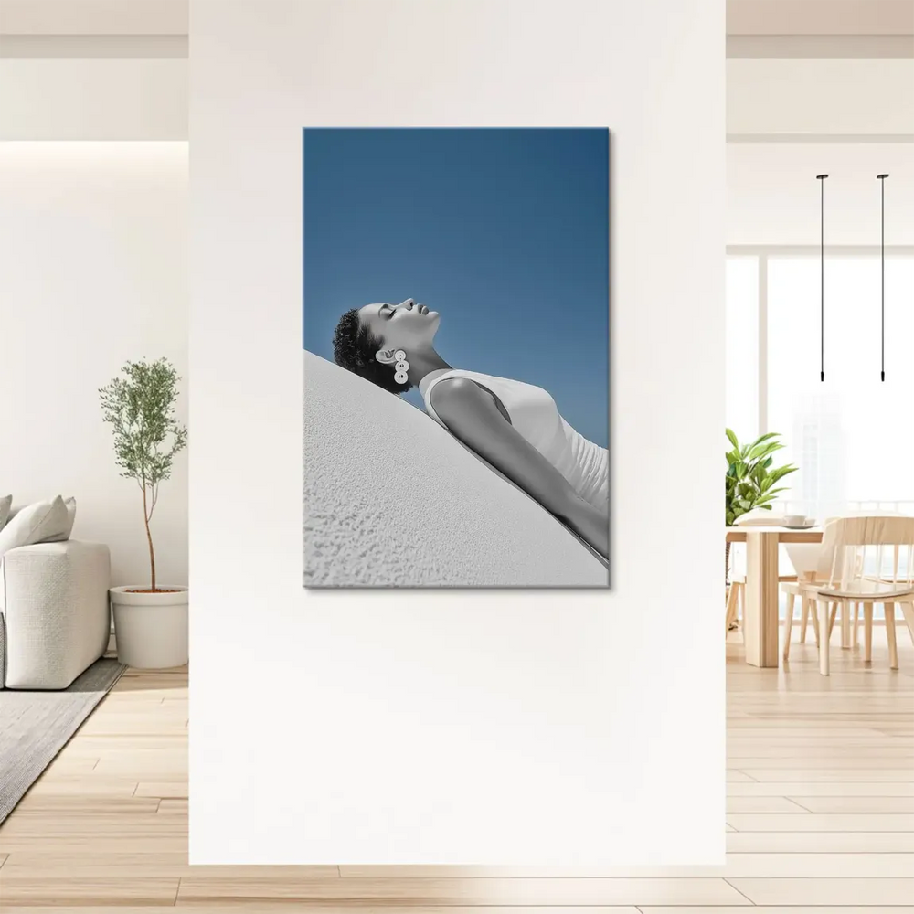 Monochrome figure against a vivid blue sky in a minimalist canvas print.