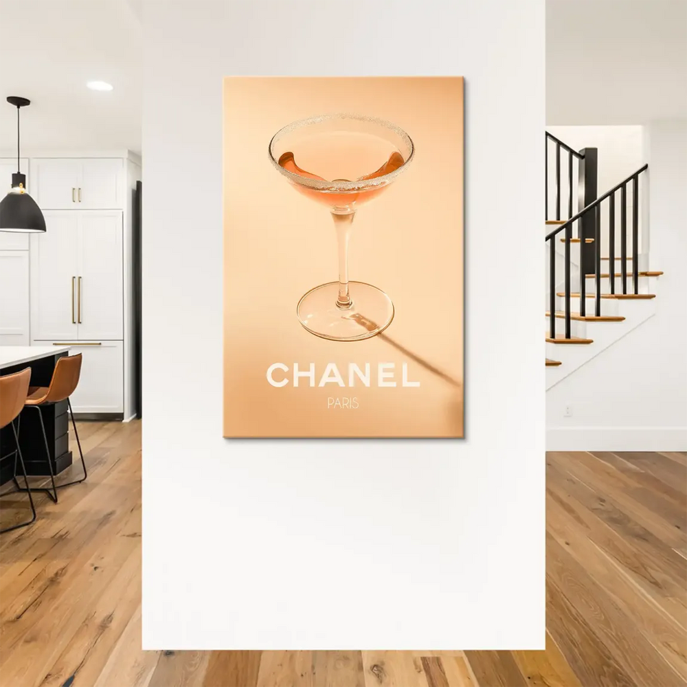 Elegant coupe glass with blush liquid and sparkling rim in Chanel art