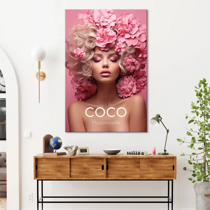 Bold COCO Mademoiselle text beneath the portrait on a pink canvas