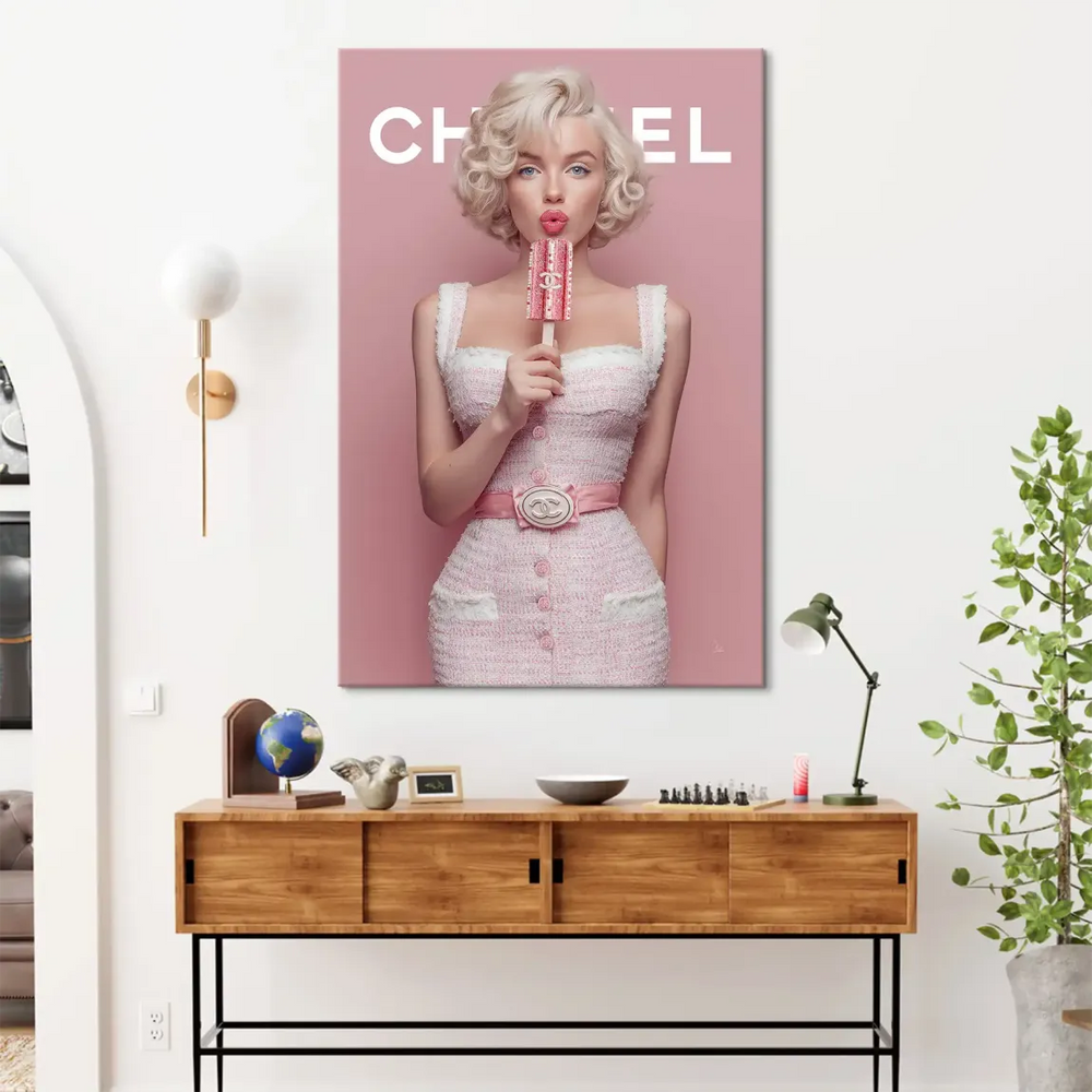 Playful pink popsicle held by a stylish figure against a solid pink background
