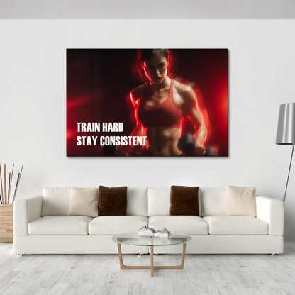Bold white typography Train Hard Stay Consistent on a motivational fitness canvas