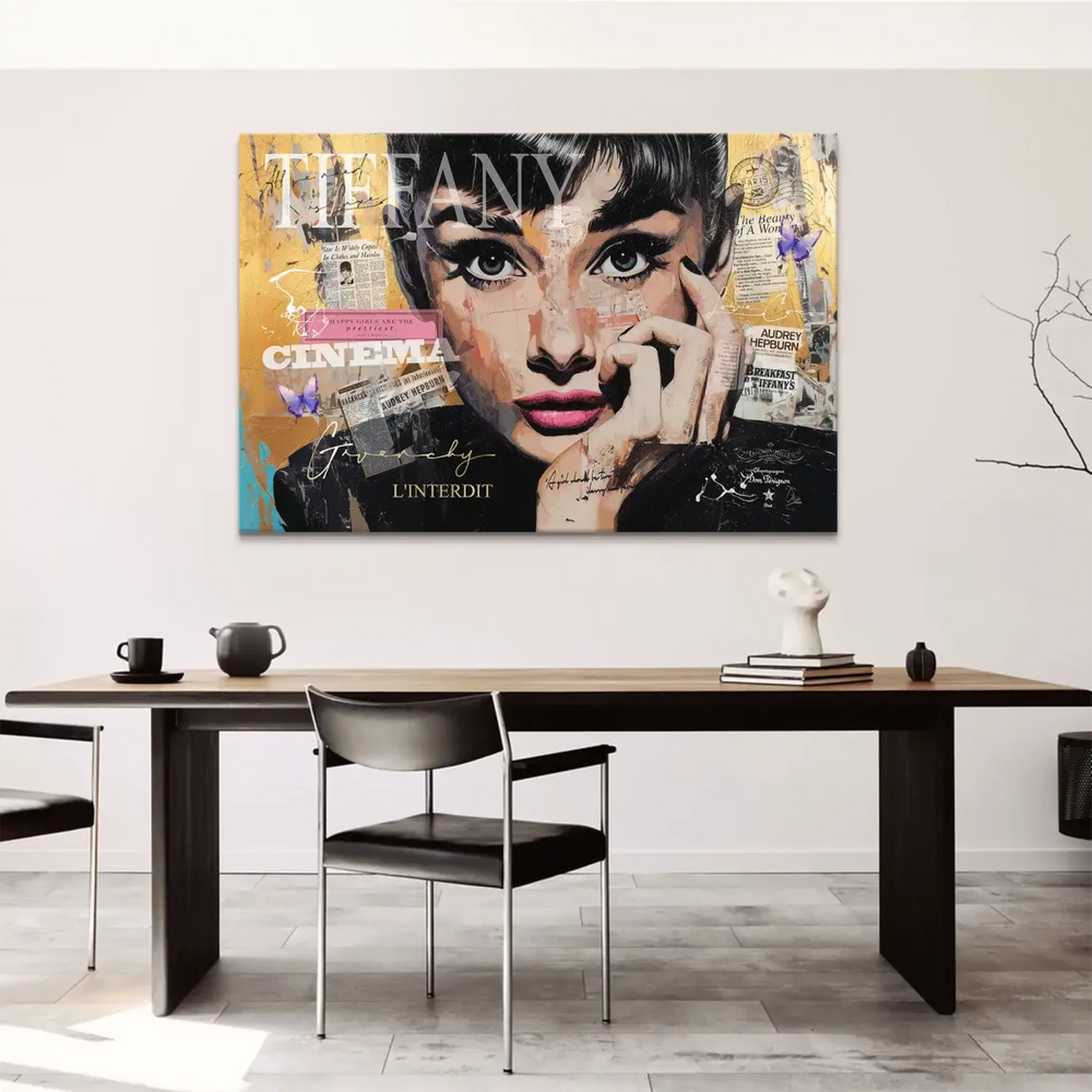 Pink lips and blue eyes stand out against black, white, and gold tones in the artwork.