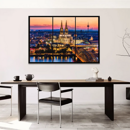 Panoramic view of Cologne skyline featuring the cathedral and glowing sky