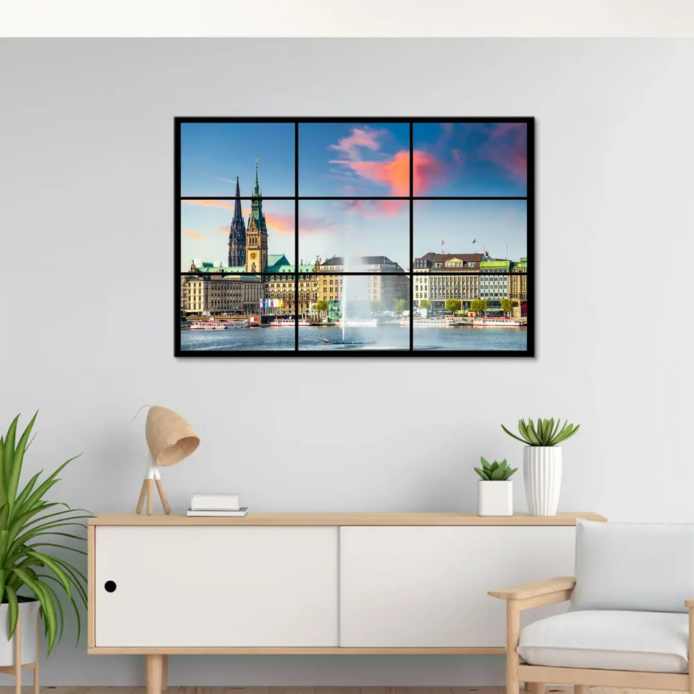 Warm orange and pink sunset over Hamburg's historic architecture against a clear blue sky.