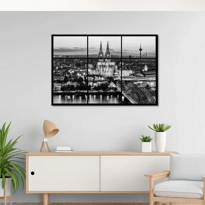 Night-time riverfront with cathedral and bridge in grayscale