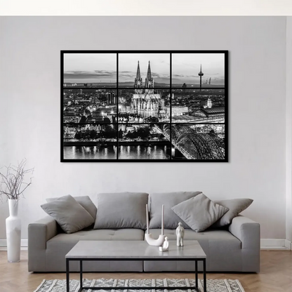 Reflections of city lights on the Rhine in a moody urban scene