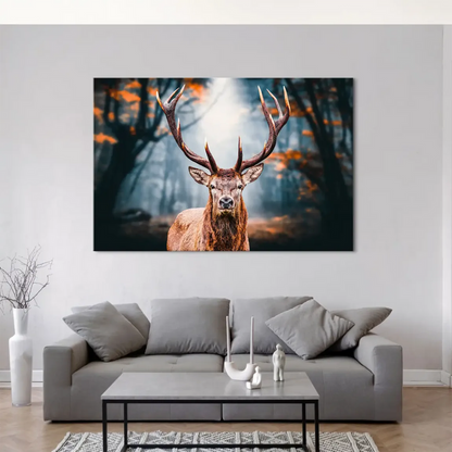 Deer bathed in warm browns and oranges among autumn leaves with a cool blue-grey forest background.