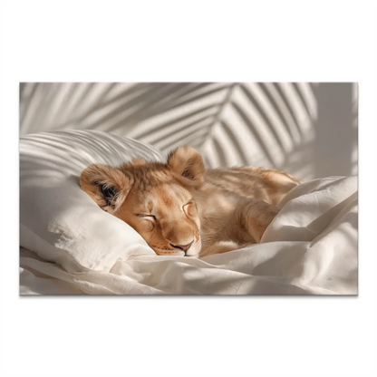 Sleeping baby lion cub on white bedding with a soft pillow