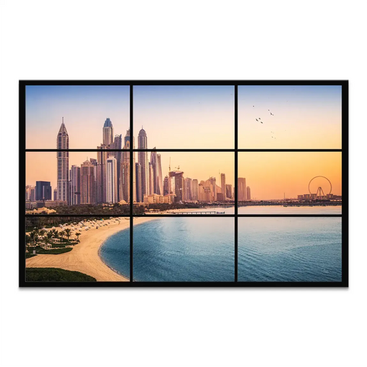 Panoramic view of Dubai's golden dunes and skyline at golden hour with a sunlit beach and palm trees