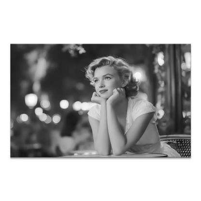 Marilyn Monroe in a contemplative pose at an outdoor cafe in a black-and-white canvas wall art