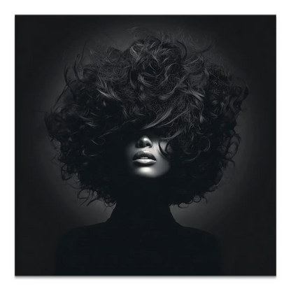 Monochrome portrait of a mysterious woman with voluminous curly hair obscuring the eyes, lips highlighted