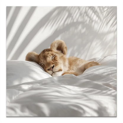 Sleeping lion cub on white pillow in a serene canvas print