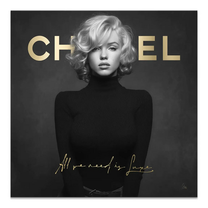 Black-and-white Marilyn Monroe portrait on a canvas with gold initials CH EL and luxe script All we need is Luxe