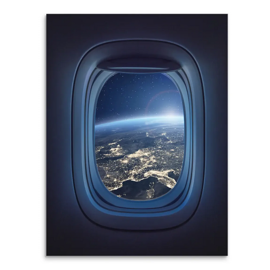 Earth from orbit seen through an airplane window with city lights below