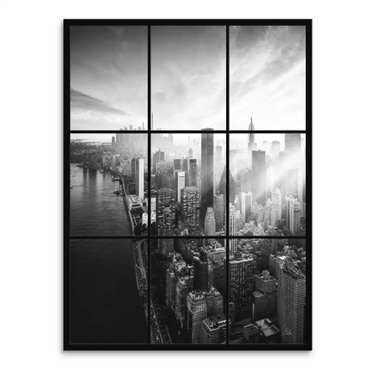 Black-and-white aerial view of New York City skyline over the East River