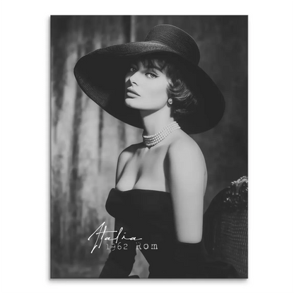 Black-and-white portrait of Sophia Loren wearing a wide-brimmed hat, pearls, and a strapless gown