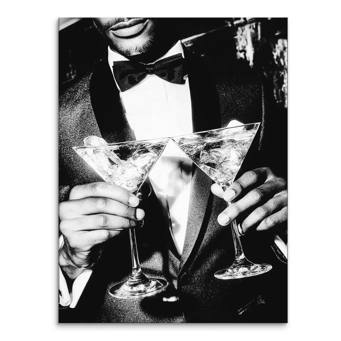 High-contrast black-and-white portrait of a man in a tuxedo holding two martini glasses filled with ice