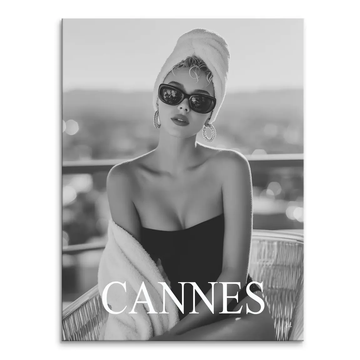 Monochrome portrait of a stylish woman wearing a towel turban and sunglasses