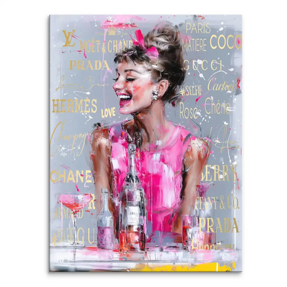 Audrey Hepburn-inspired Pop Art canvas: laughing figure in a fuchsia dress holding a champagne bottle against a gray background with gold logos.