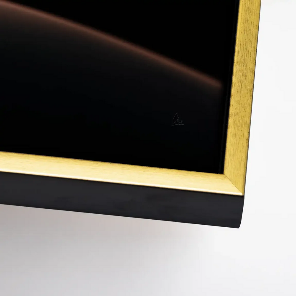 Contemporary wall art featuring a moody dune form with an orange-copper highlight