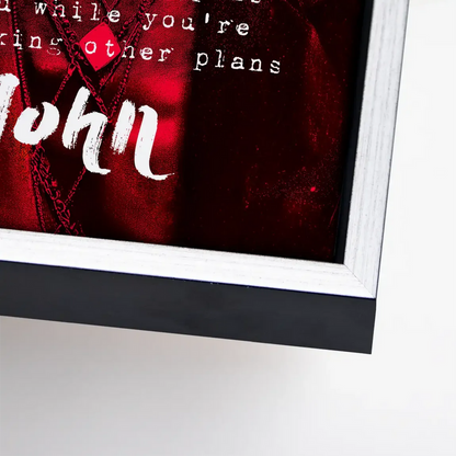 Bold red canvas featuring John Lennon name and quote