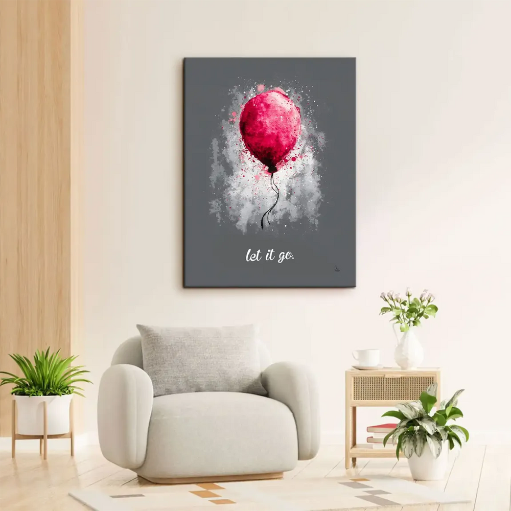 White 'let it go' script beneath the balloon on canvas