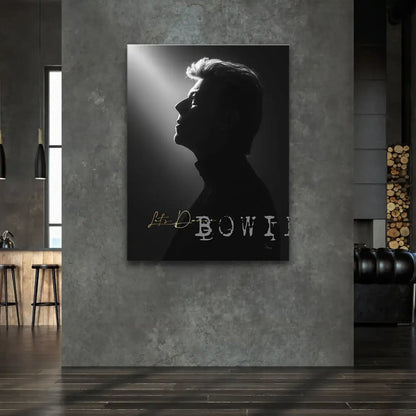 Gold 'Let's Dance' typography beneath David Bowie portrait